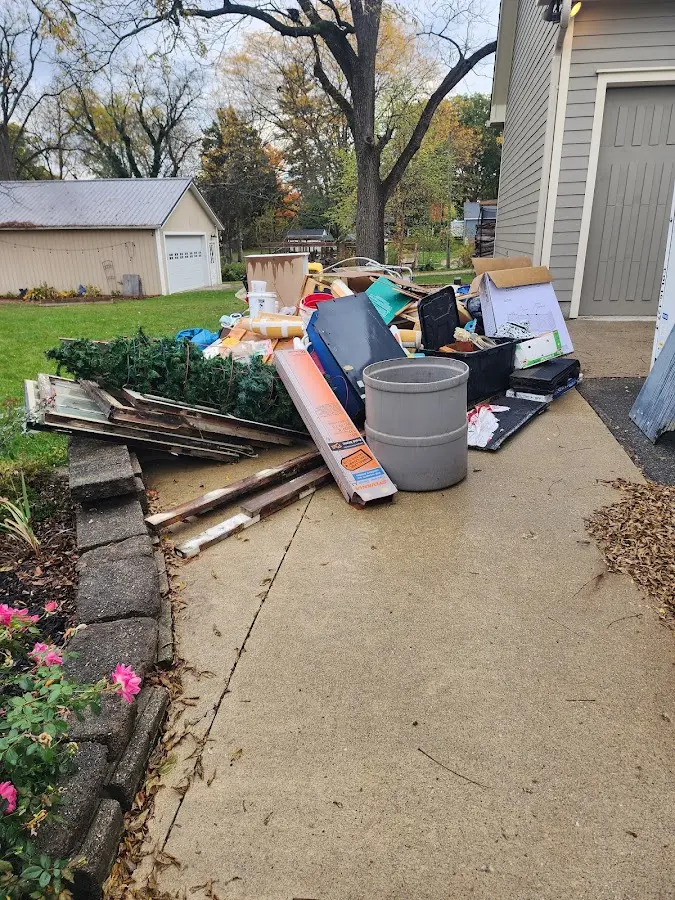 Dumpster being loaded with debris for Estate Cleanout Dumpster Rental in Laramie